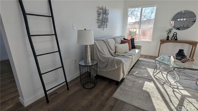 living room with baseboards and wood finished floors