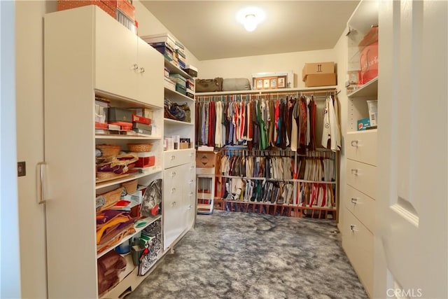 walk in closet featuring carpet