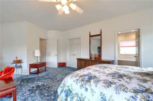 carpeted bedroom featuring connected bathroom, a closet, and a ceiling fan