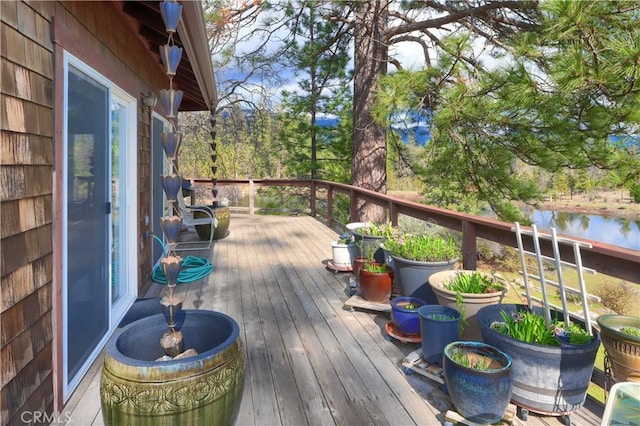 wooden deck with a water view