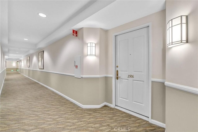 hall with recessed lighting, baseboards, and carpet floors