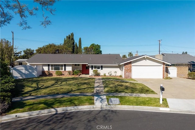 single story home featuring a front lawn, fence, concrete driveway, a garage, and a gate