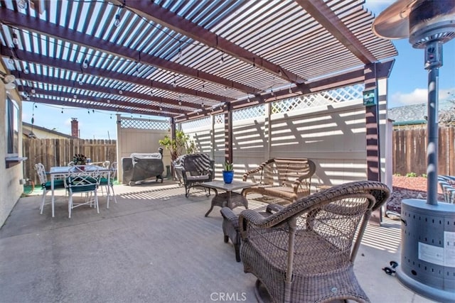 view of patio / terrace featuring outdoor dining area, area for grilling, a fenced backyard, and a pergola