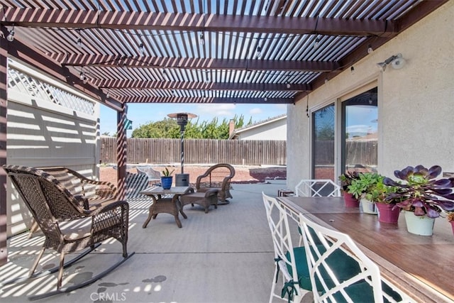 view of patio / terrace featuring outdoor dining area, a fenced backyard, and a pergola