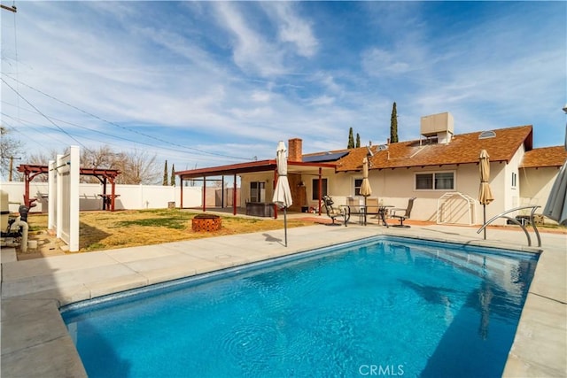 view of swimming pool with a patio area, a fenced in pool, a fenced backyard, and a pergola