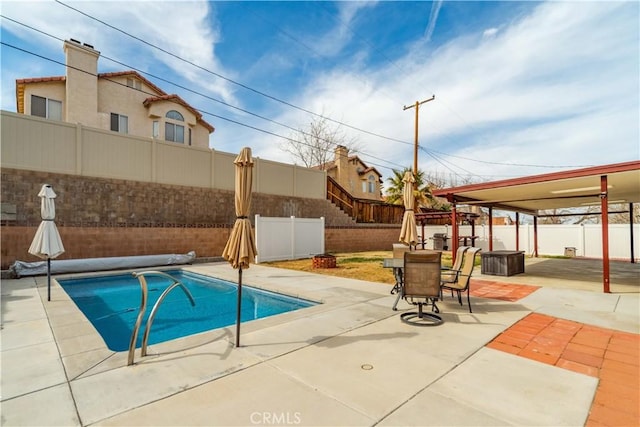 view of pool featuring a patio area, a fenced backyard, and a fenced in pool