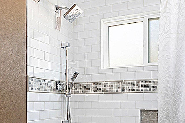 interior space featuring tiled shower