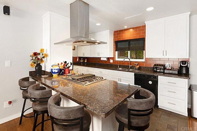 kitchen with island exhaust hood, a sink, stainless steel gas stovetop, dishwasher, and backsplash