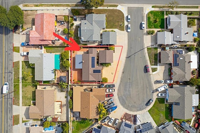 birds eye view of property with a residential view