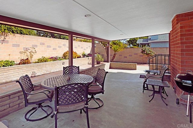 view of patio / terrace featuring outdoor dining area and a fenced backyard