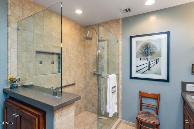 bathroom with vanity, recessed lighting, visible vents, and a stall shower