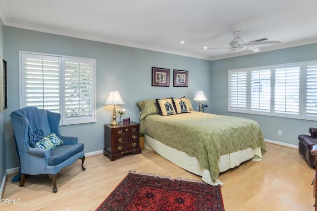 bedroom featuring wood finished floors, baseboards, and ornamental molding