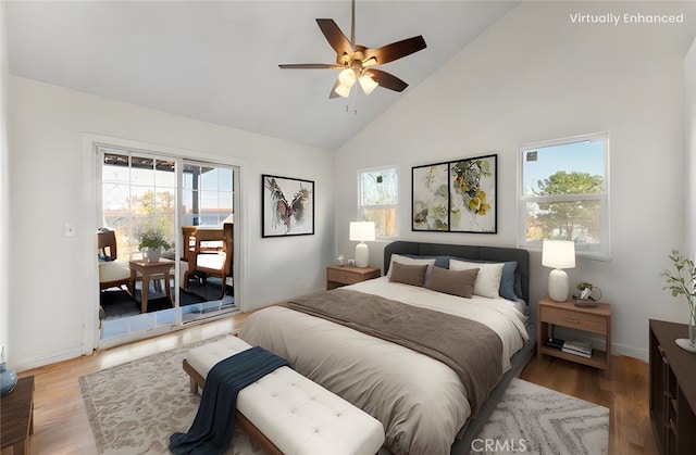 bedroom with baseboards, wood finished floors, high vaulted ceiling, and access to outside