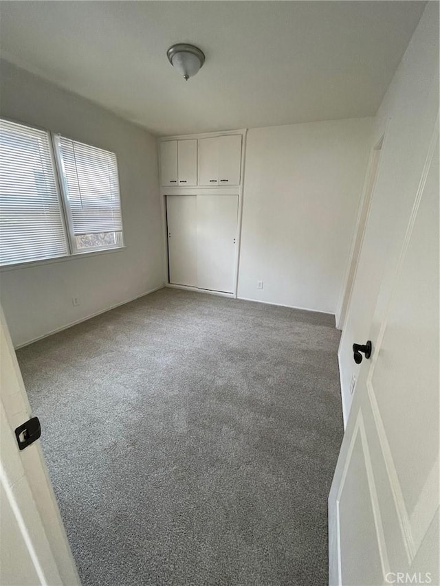 unfurnished bedroom featuring carpet flooring