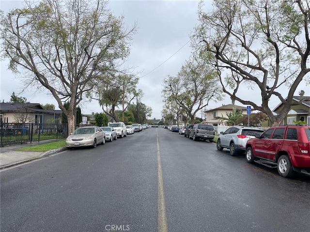 view of road with sidewalks and a residential view