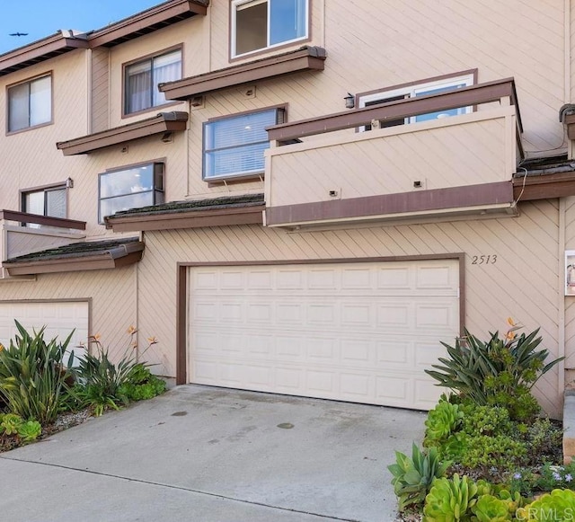 exterior space featuring an attached garage and driveway