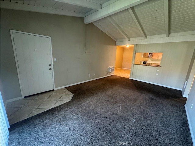 unfurnished living room featuring tile patterned floors, vaulted ceiling with beams, carpet, and baseboards