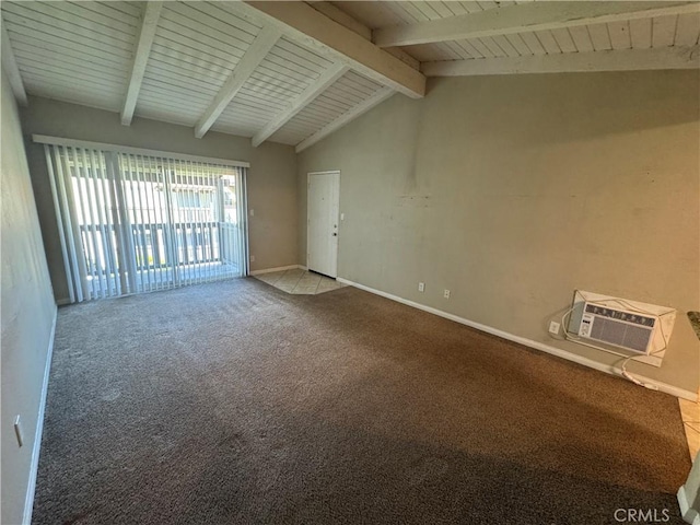 empty room featuring lofted ceiling with beams, carpet flooring, baseboards, and a wall mounted air conditioner