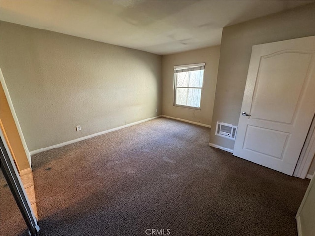 unfurnished bedroom featuring visible vents, baseboards, and carpet floors