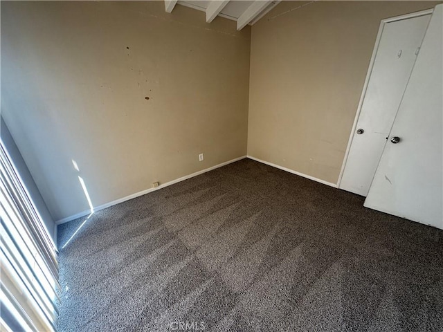 interior space with a wealth of natural light, beamed ceiling, and baseboards