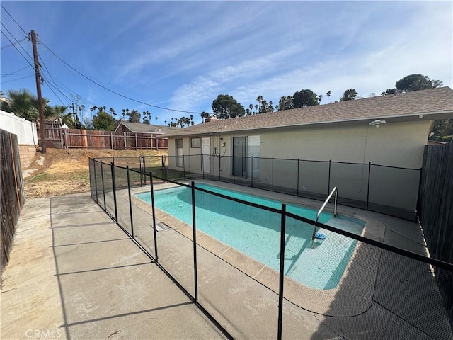 view of swimming pool featuring a patio area, a fenced in pool, and a fenced backyard