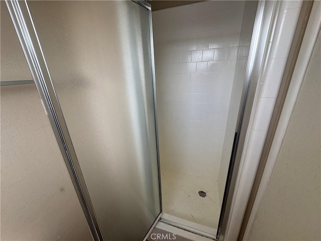 bathroom with a shower stall