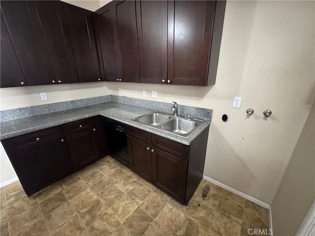 kitchen featuring black dishwasher, baseboards, dark brown cabinets, and a sink