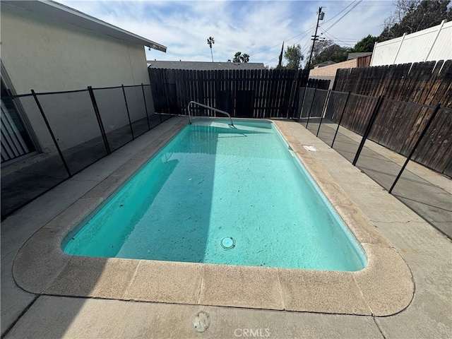 view of pool featuring a fenced in pool and a fenced backyard