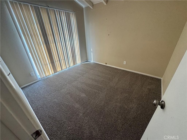 empty room with baseboards and carpet floors