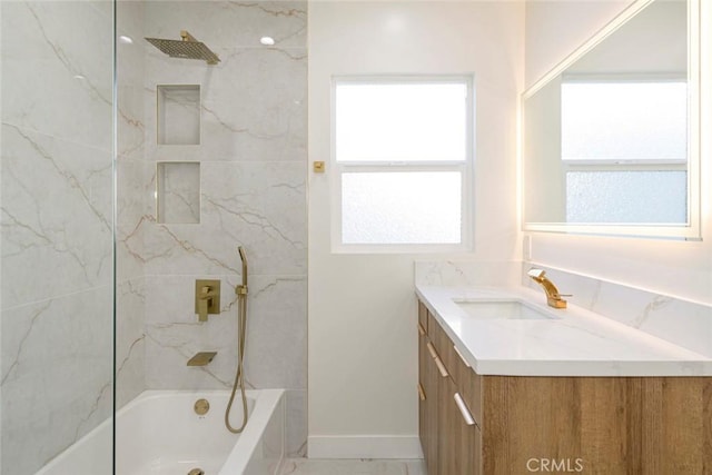 full bath with tub / shower combination, baseboards, marble finish floor, and vanity