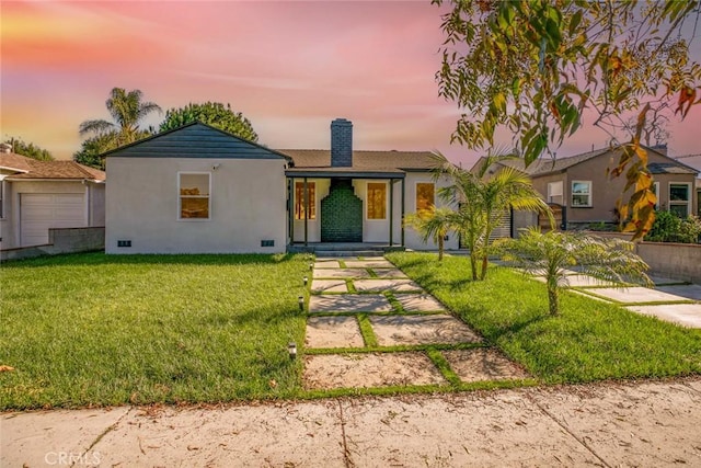 single story home with stucco siding, a lawn, a chimney, and crawl space