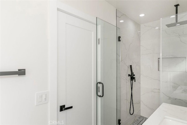 full bathroom with recessed lighting and a marble finish shower