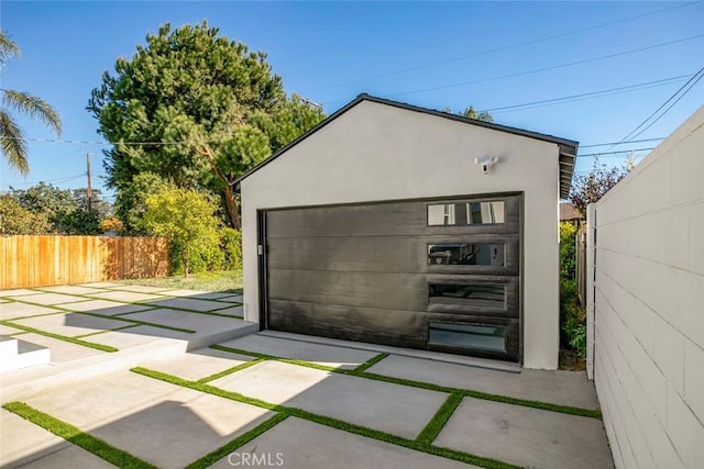 detached garage with fence