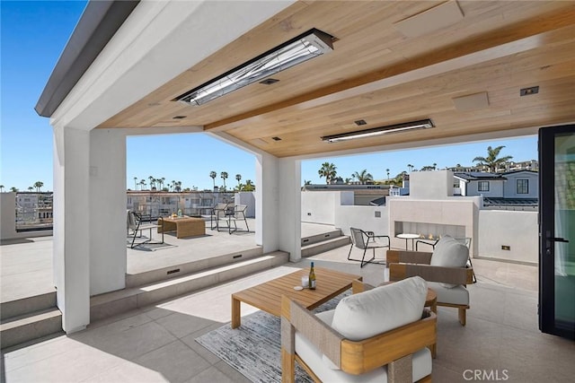 20 Balboa Cvs, Newport Beach, CA 92663 - view of patio / terrace with an outdoor living space with a fire pit