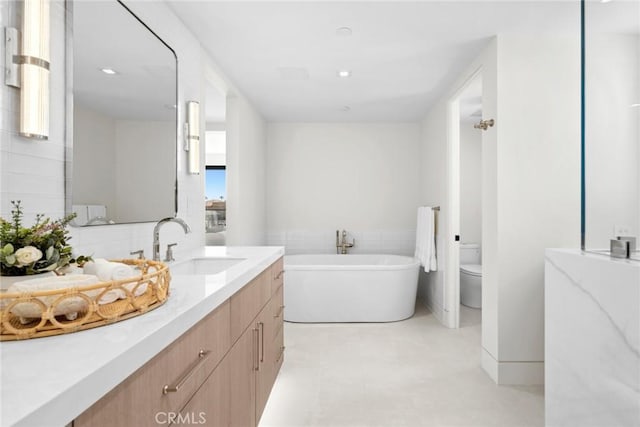20 Balboa Cvs, Newport Beach, CA 92663 - full bathroom with tile patterned floors, a freestanding tub, vanity, and toilet