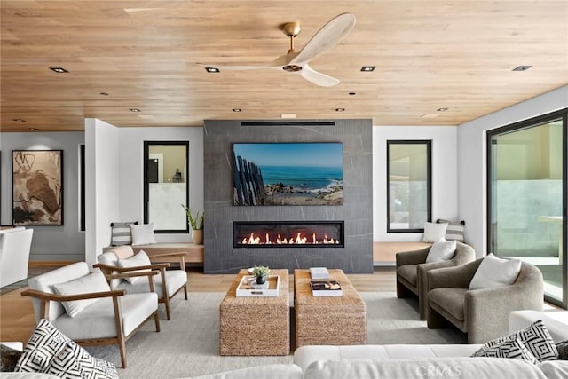 20 Balboa Cvs, Newport Beach, CA 92663 - home theater featuring a tiled fireplace, wood ceiling, and wood finished floors