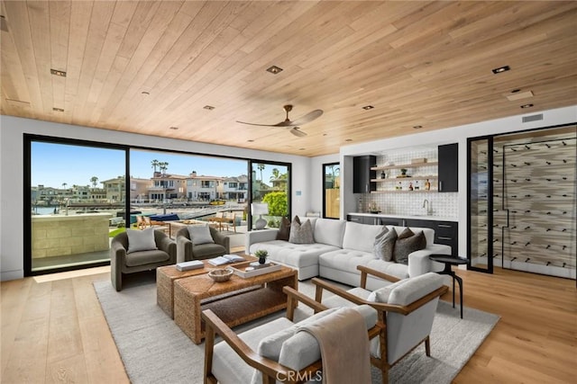 20 Balboa Cvs, Newport Beach, CA 92663 - living area with a bar, light wood-style flooring, wooden ceiling, and ceiling fan