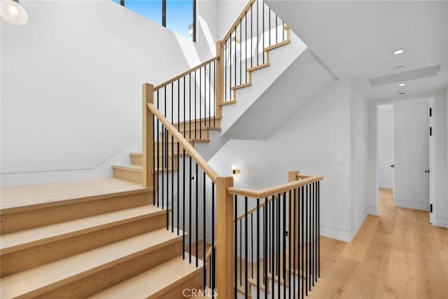 20 Balboa Cvs, Newport Beach, CA 92663 - stairway featuring recessed lighting, baseboards, and wood finished floors
