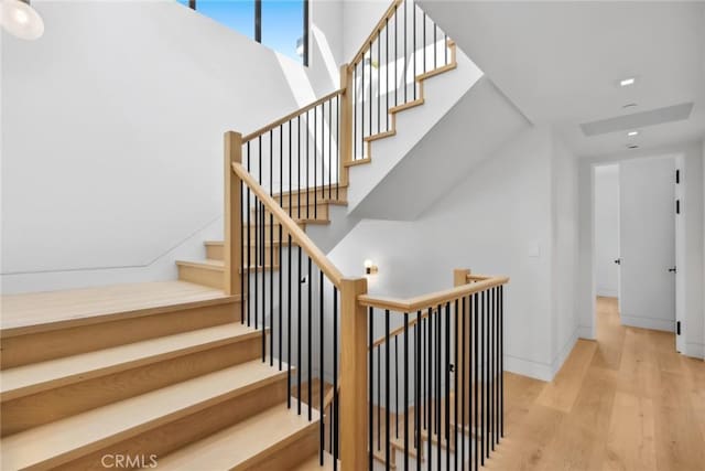 20 Balboa Cvs, Newport Beach, CA 92663 - staircase featuring wood finished floors and recessed lighting