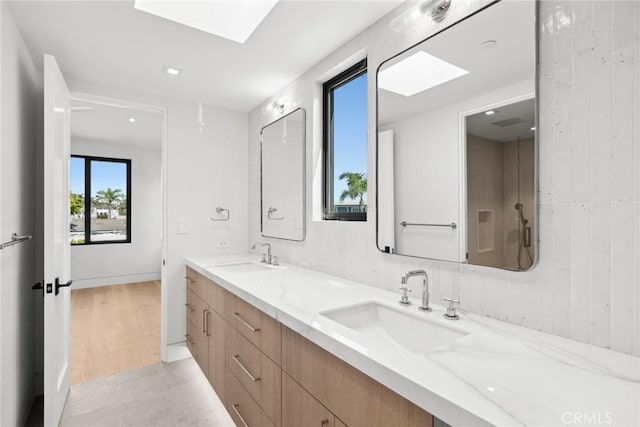 20 Balboa Cvs, Newport Beach, CA 92663 - full bathroom featuring double vanity and a skylight
