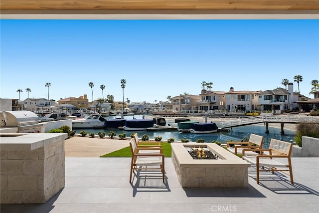 20 Balboa Cvs, Newport Beach, CA 92663 - view of patio featuring a grill, an outdoor fire pit, and a residential view