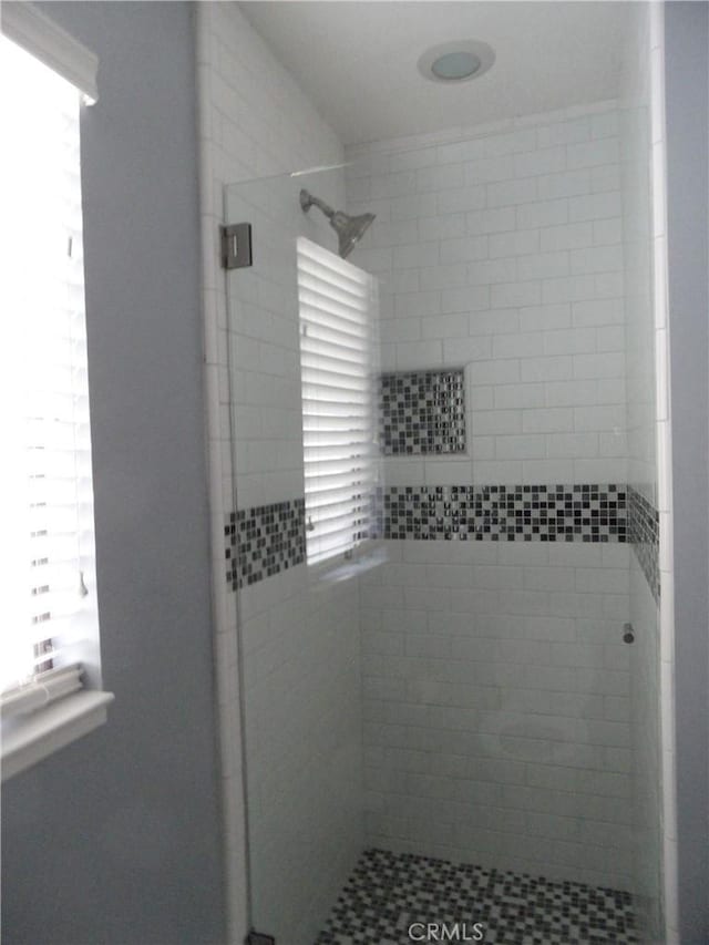 full bathroom with a stall shower