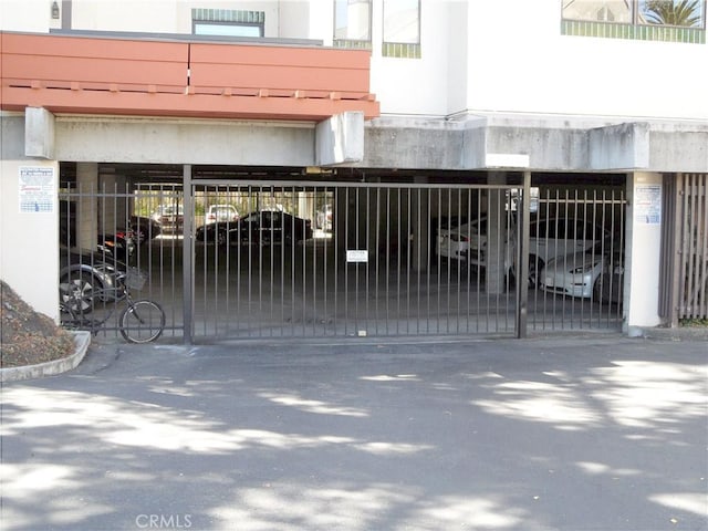 view of gate featuring fence