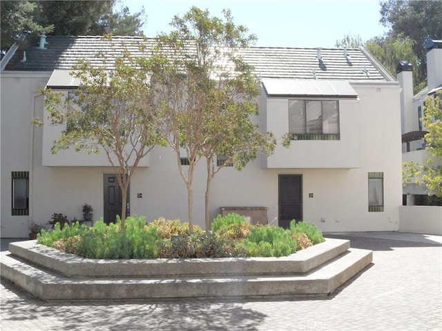 view of front facade featuring stucco siding