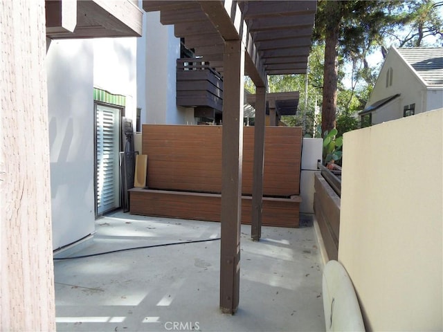 view of patio featuring fence