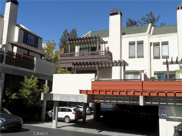 view of building exterior with a parking lot