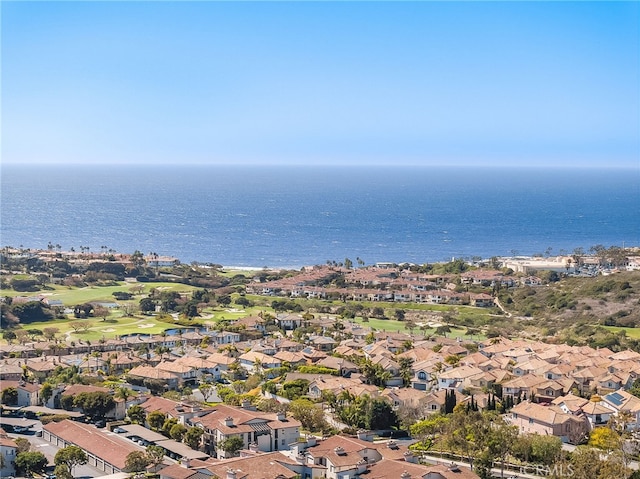 drone / aerial view featuring a residential view and a water view