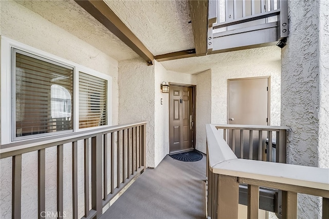 view of exterior entry featuring stucco siding