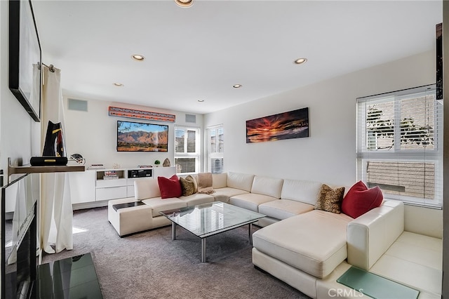 carpeted living area with plenty of natural light, recessed lighting, and visible vents