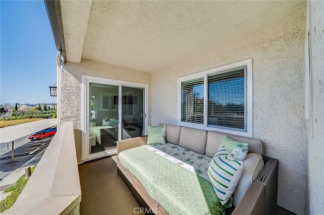 balcony featuring an outdoor living space and a sunroom